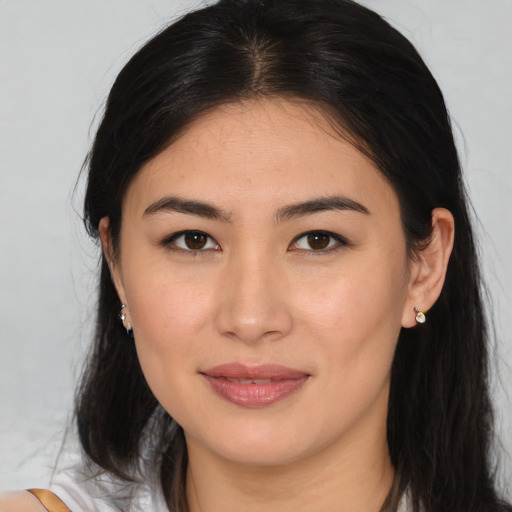 Joyful asian young-adult female with medium  brown hair and brown eyes
