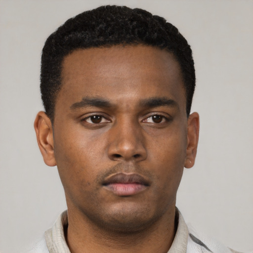 Neutral black young-adult male with short  black hair and brown eyes