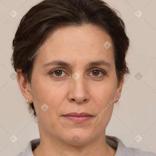 Joyful white adult female with short  brown hair and brown eyes