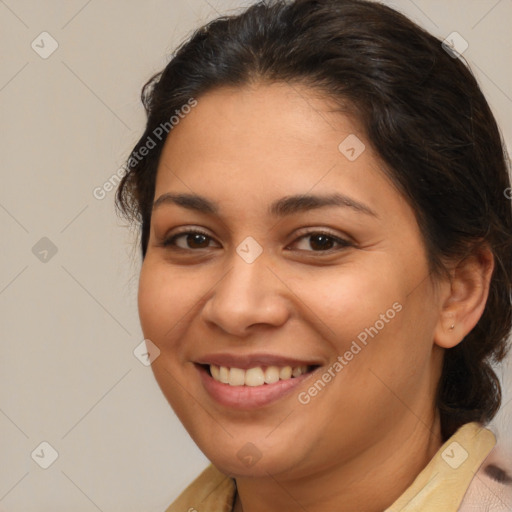 Joyful latino young-adult female with medium  brown hair and brown eyes