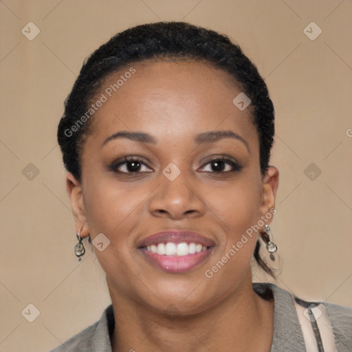 Joyful black young-adult female with short  black hair and brown eyes