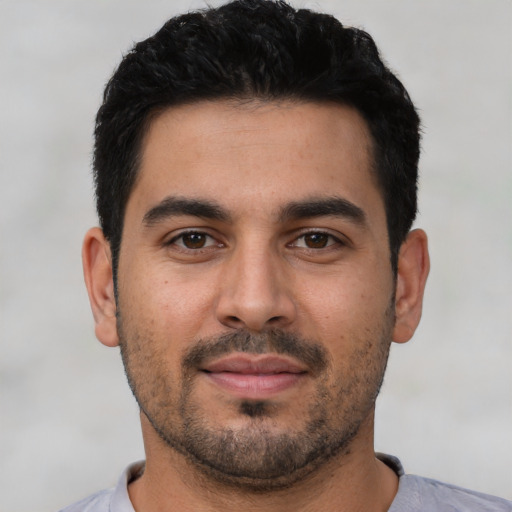 Neutral latino young-adult male with short  black hair and brown eyes
