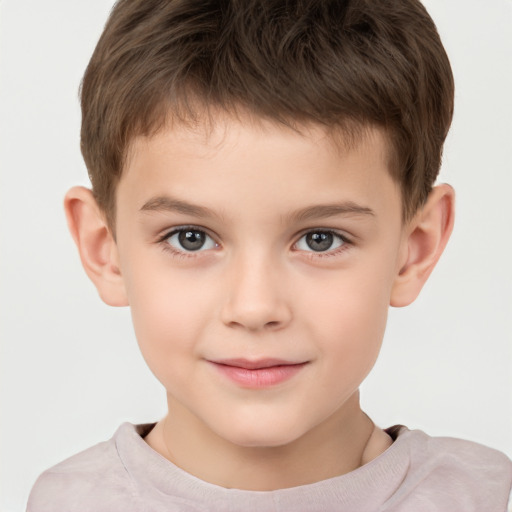 Joyful white child male with short  brown hair and brown eyes