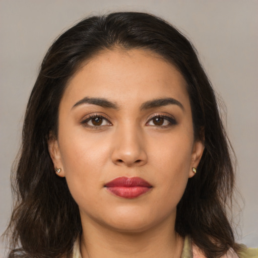 Neutral latino young-adult female with medium  brown hair and brown eyes