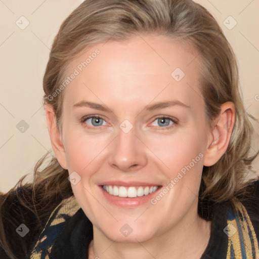 Joyful white adult female with medium  brown hair and blue eyes