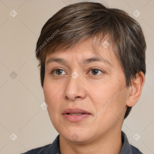 Joyful white adult female with short  brown hair and brown eyes