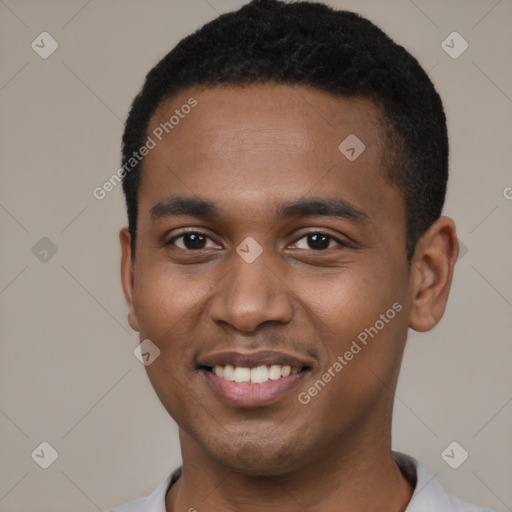 Joyful black young-adult male with short  black hair and brown eyes