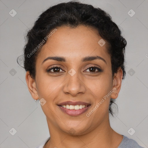 Joyful latino young-adult female with short  brown hair and brown eyes