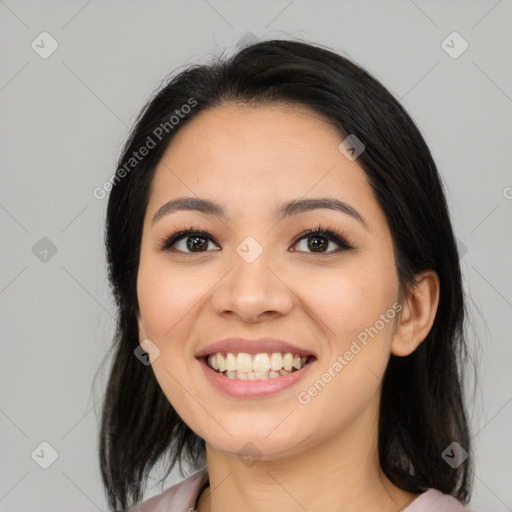 Joyful asian young-adult female with medium  black hair and brown eyes