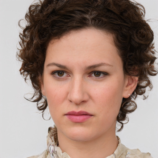 Joyful white young-adult female with medium  brown hair and green eyes