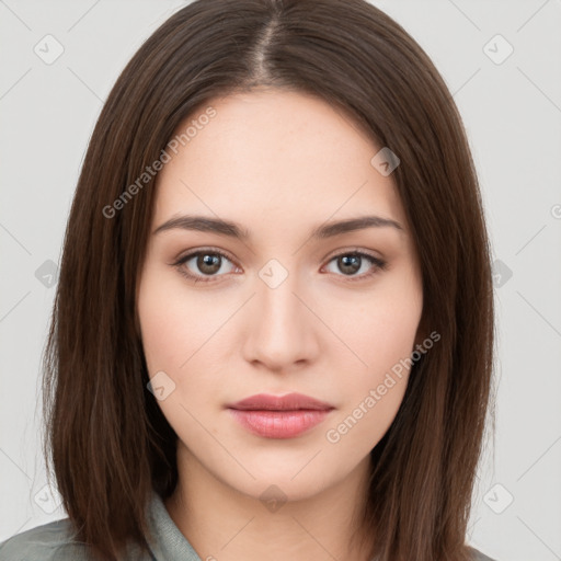 Neutral white young-adult female with long  brown hair and brown eyes