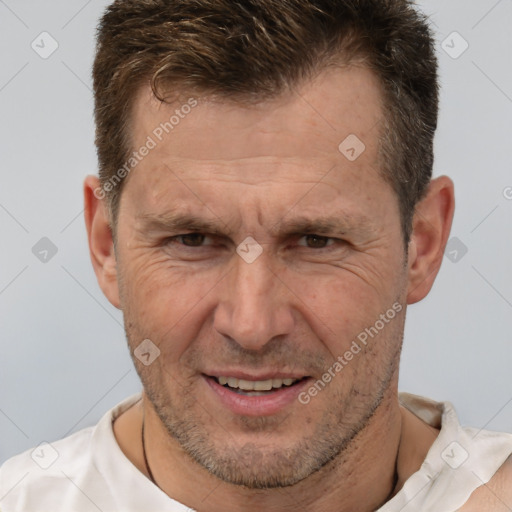 Joyful white adult male with short  brown hair and brown eyes