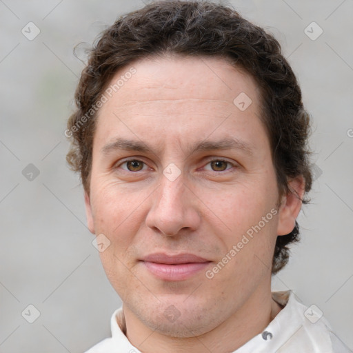 Joyful white adult male with short  brown hair and grey eyes