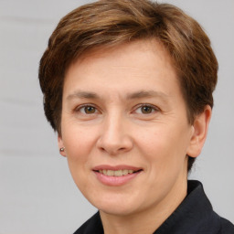 Joyful white adult female with short  brown hair and brown eyes