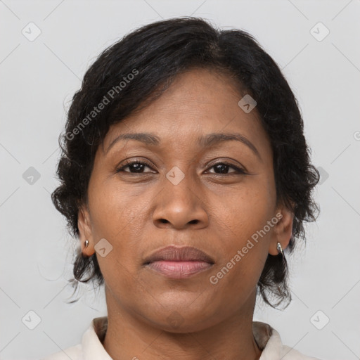 Joyful latino adult female with medium  brown hair and brown eyes