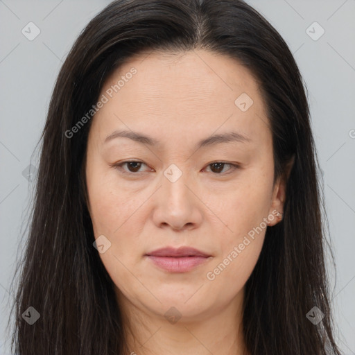 Joyful asian young-adult female with long  brown hair and brown eyes