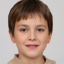 Joyful white child male with short  brown hair and brown eyes