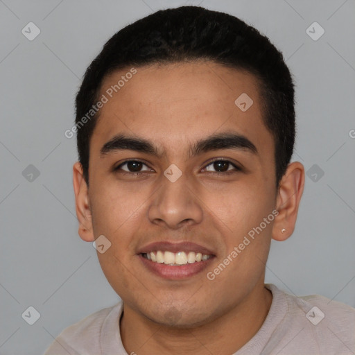 Joyful latino young-adult male with short  black hair and brown eyes