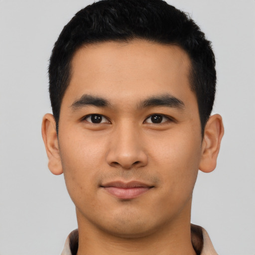 Joyful asian young-adult male with short  black hair and brown eyes