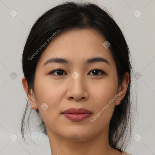 Joyful asian young-adult female with medium  brown hair and brown eyes