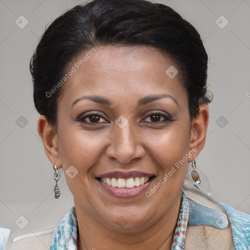 Joyful latino adult female with short  brown hair and brown eyes