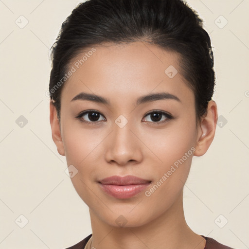 Joyful latino young-adult female with short  brown hair and brown eyes