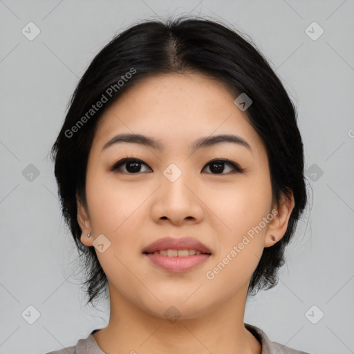 Joyful asian young-adult female with medium  black hair and brown eyes