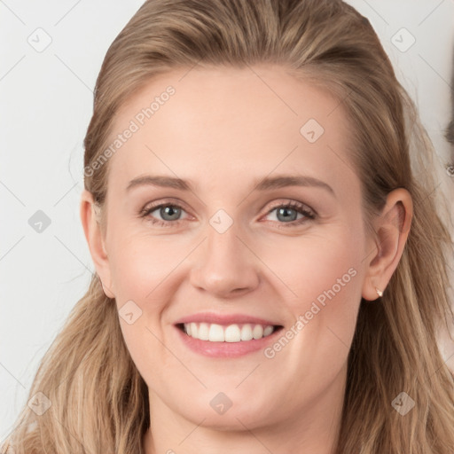 Joyful white young-adult female with long  brown hair and blue eyes