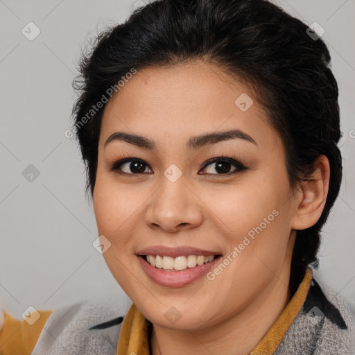 Joyful latino young-adult female with short  brown hair and brown eyes