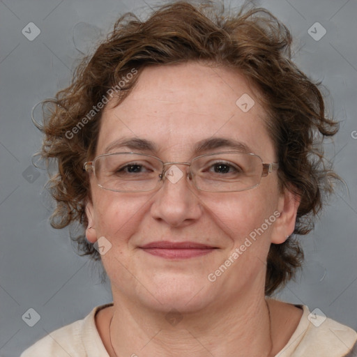 Joyful white adult female with medium  brown hair and blue eyes