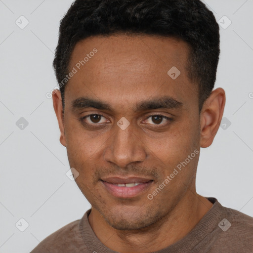 Joyful black young-adult male with short  brown hair and brown eyes