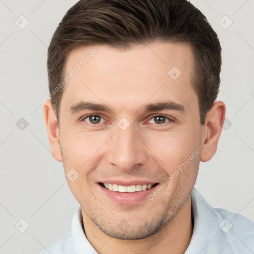 Joyful white young-adult male with short  brown hair and brown eyes