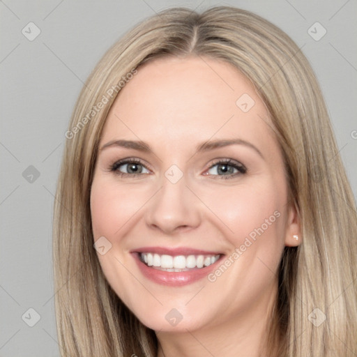 Joyful white young-adult female with long  brown hair and blue eyes