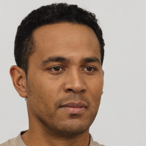 Neutral latino young-adult male with short  brown hair and brown eyes