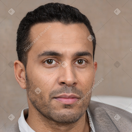 Neutral white young-adult male with short  black hair and brown eyes