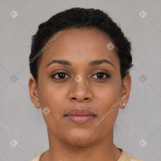 Joyful black young-adult female with short  brown hair and brown eyes