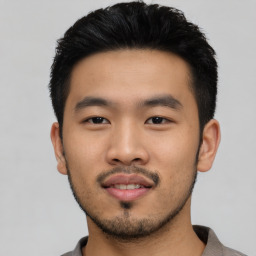 Neutral asian young-adult male with short  black hair and brown eyes