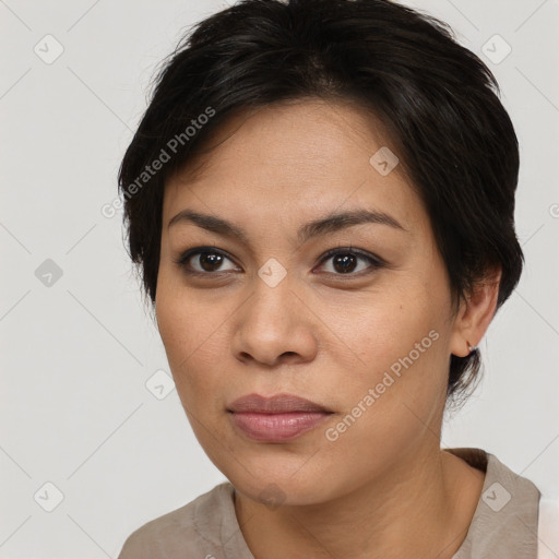 Joyful latino young-adult female with medium  brown hair and brown eyes