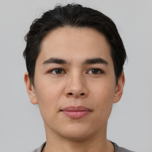 Joyful white young-adult male with short  black hair and brown eyes