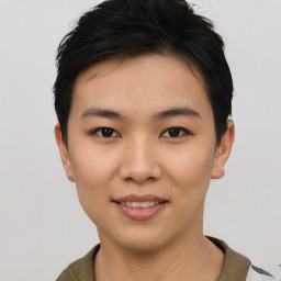 Joyful asian young-adult female with short  black hair and brown eyes