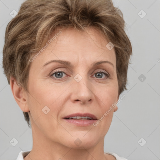 Joyful white adult female with short  brown hair and grey eyes