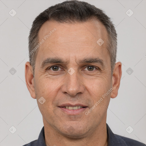 Joyful white adult male with short  brown hair and brown eyes