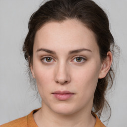 Neutral white young-adult female with medium  brown hair and green eyes