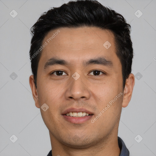 Joyful asian young-adult male with short  black hair and brown eyes