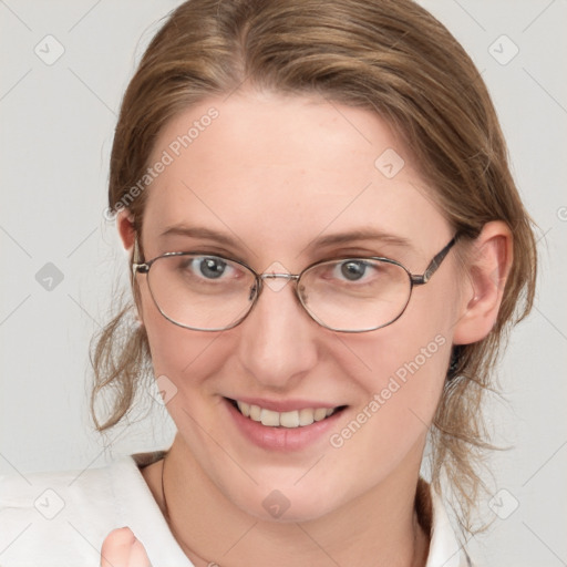 Joyful white young-adult female with medium  brown hair and blue eyes