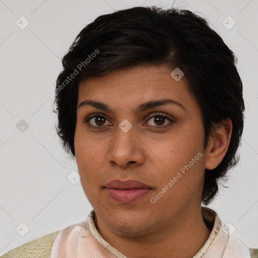 Joyful latino young-adult female with medium  brown hair and brown eyes