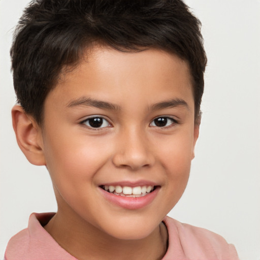 Joyful white child male with short  brown hair and brown eyes