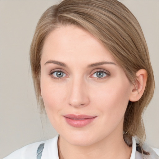 Joyful white young-adult female with medium  brown hair and blue eyes