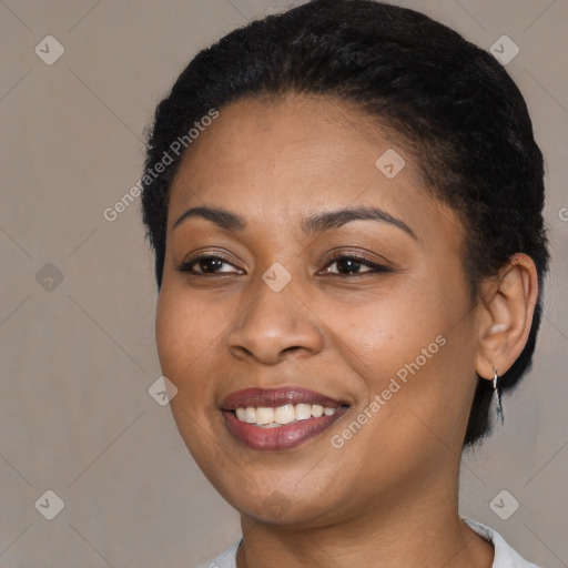 Joyful black young-adult female with short  black hair and brown eyes