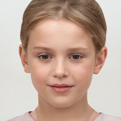 Joyful white child female with short  brown hair and brown eyes